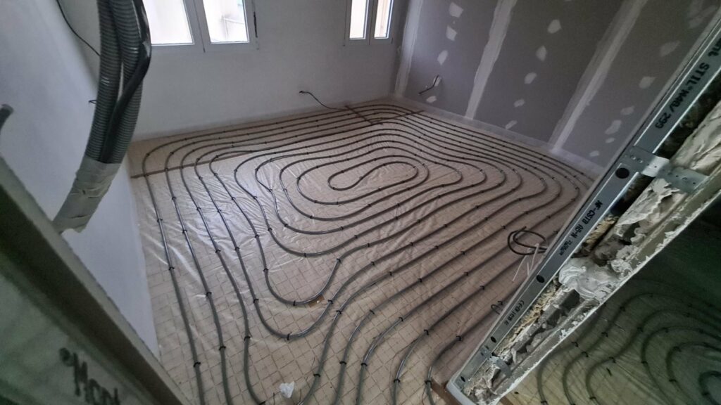 Plancher chauffant serpentin pompe à chaleur transition énergétique